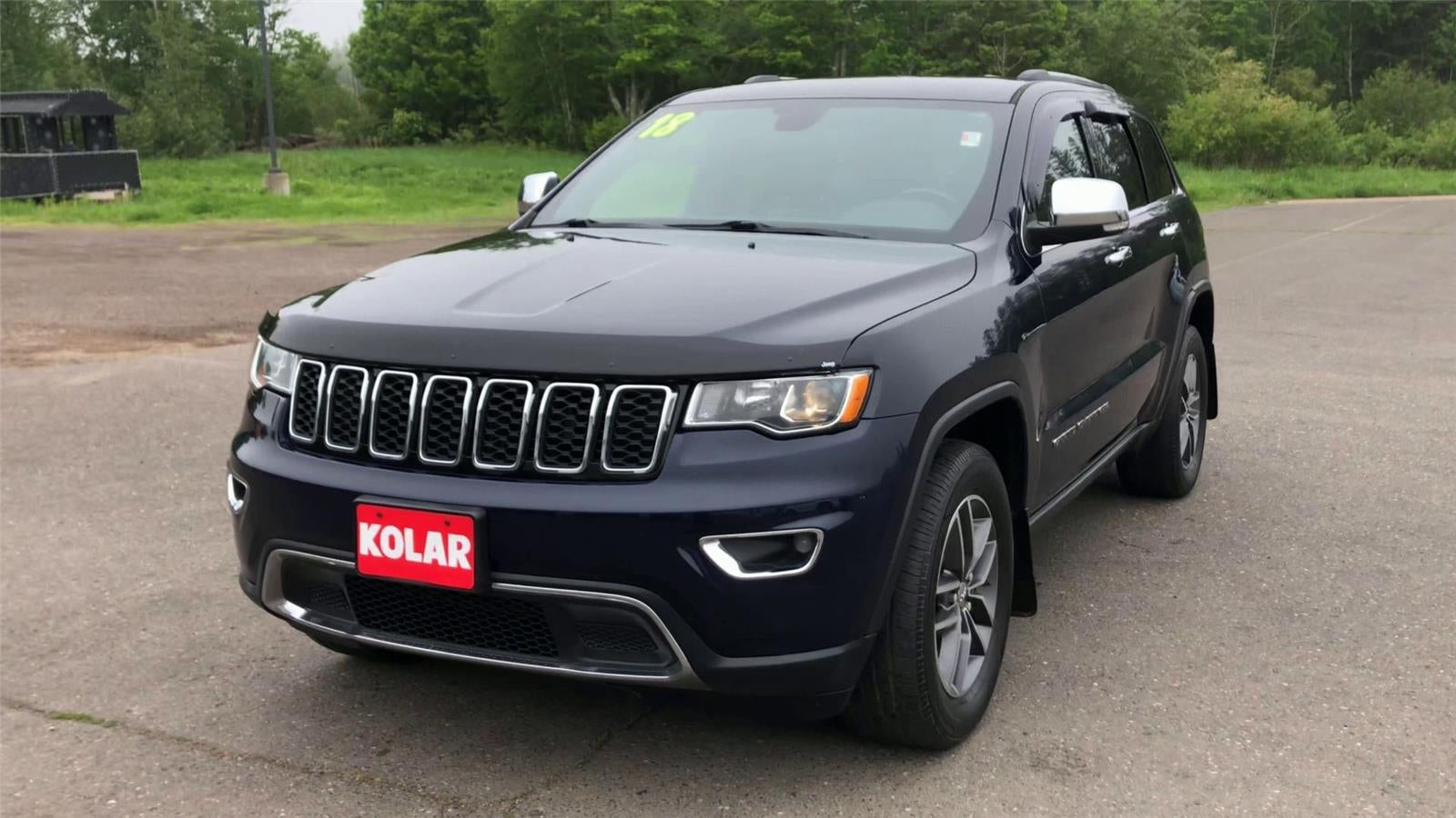 2018 Jeep Grand Cherokee — rear three-quarter view