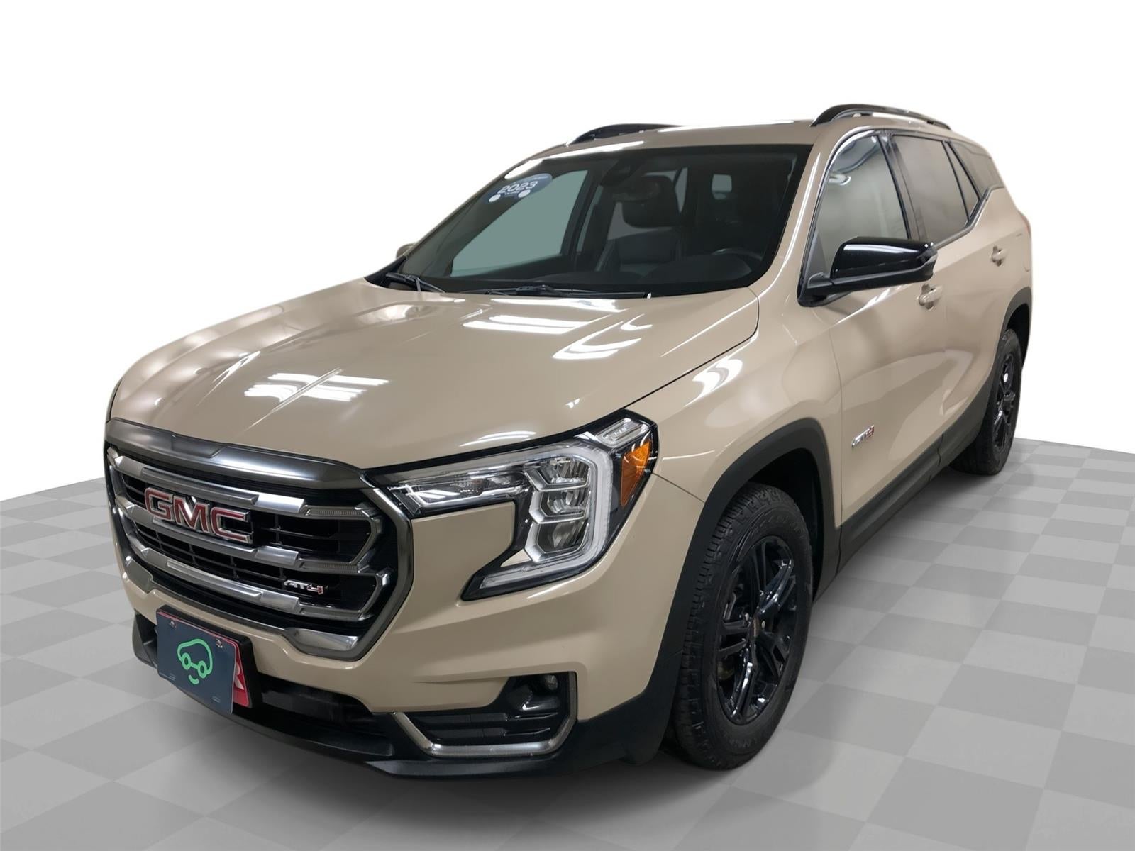 2023 GMC Terrain AT4 in Desert Sand Metallic — front three-quarter view